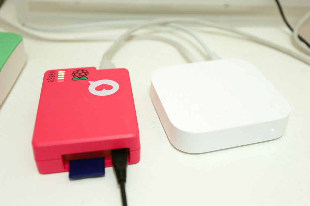 The RaspberryPi that runs fullhn.com, next to my Airport Express